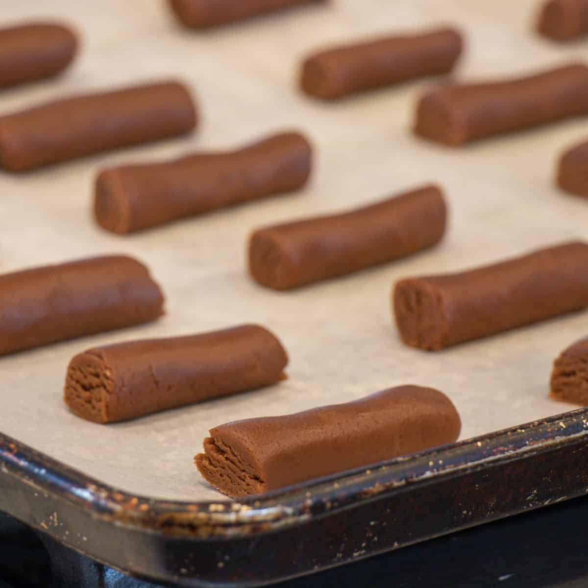 Raw cookies on a tray ready to bake.