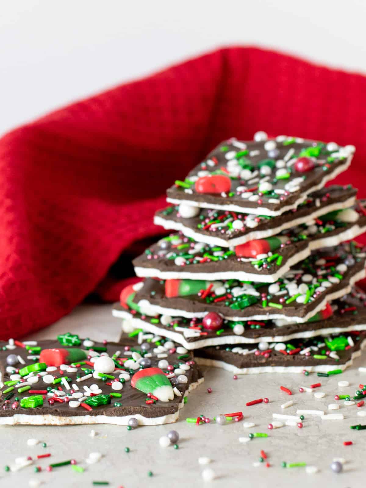 A tall image of a stack of chocolate bark.