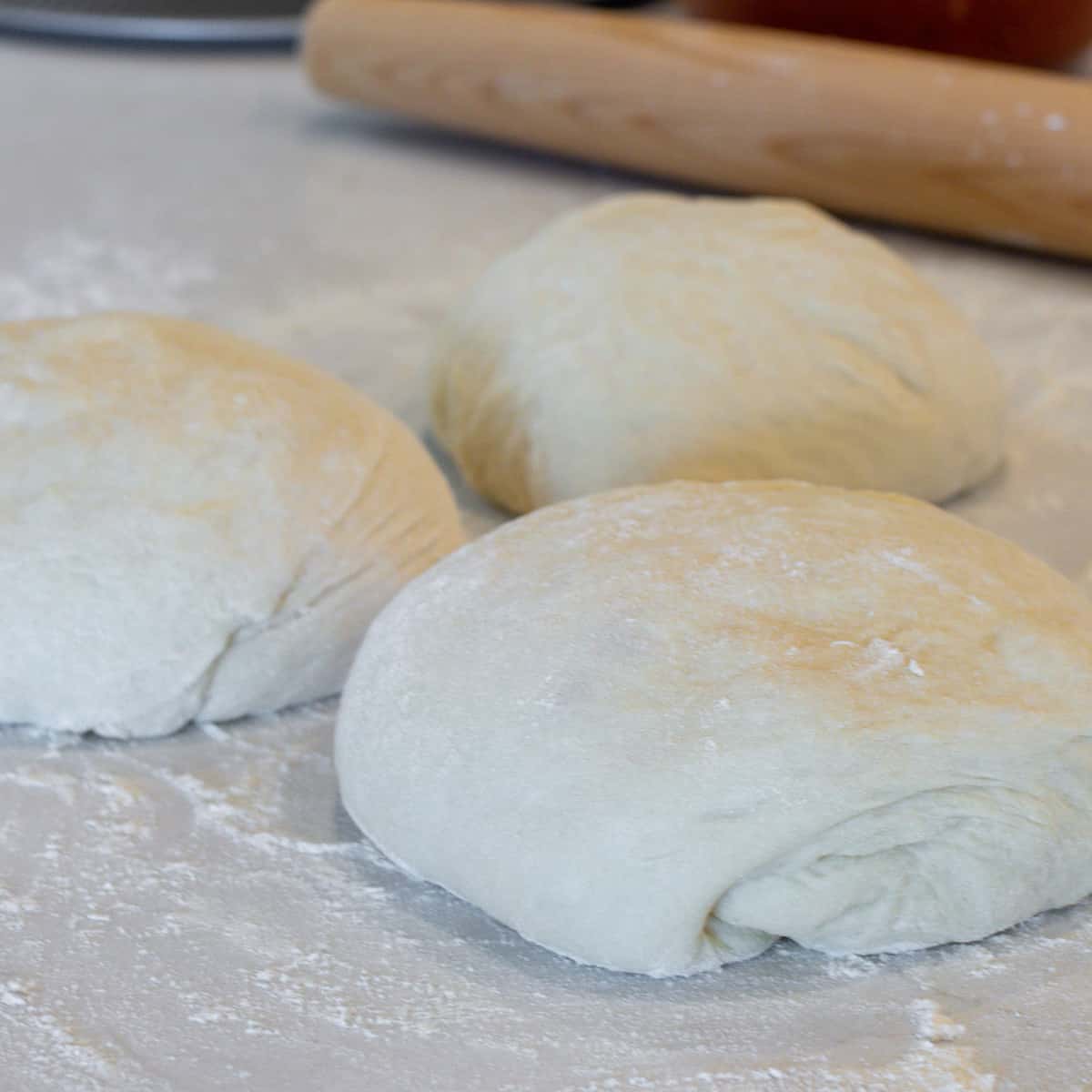 Dough divided into three equal portions.