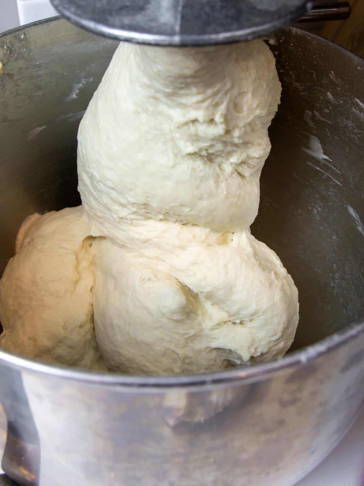 Pizza dough finished kneading with a dough hook.