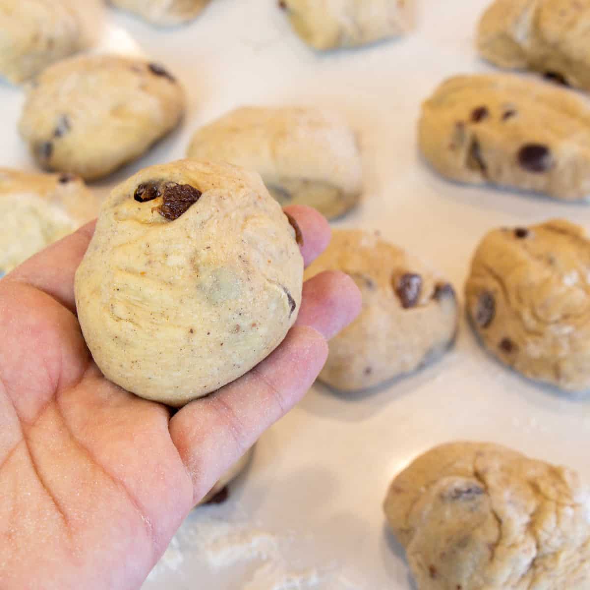 Portion of dough formed into a roll.