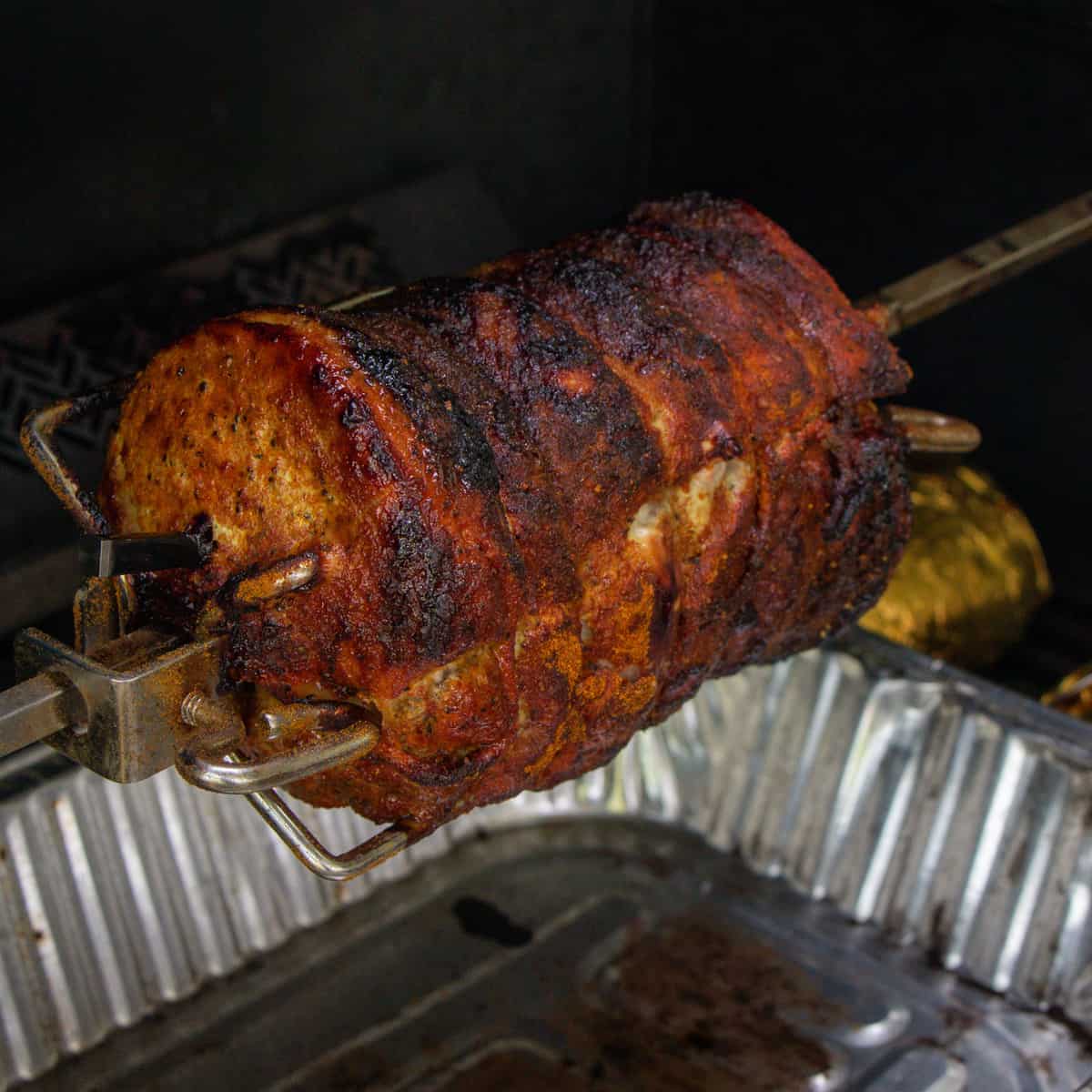 Rotisserie pork roast ready to come off the grill.