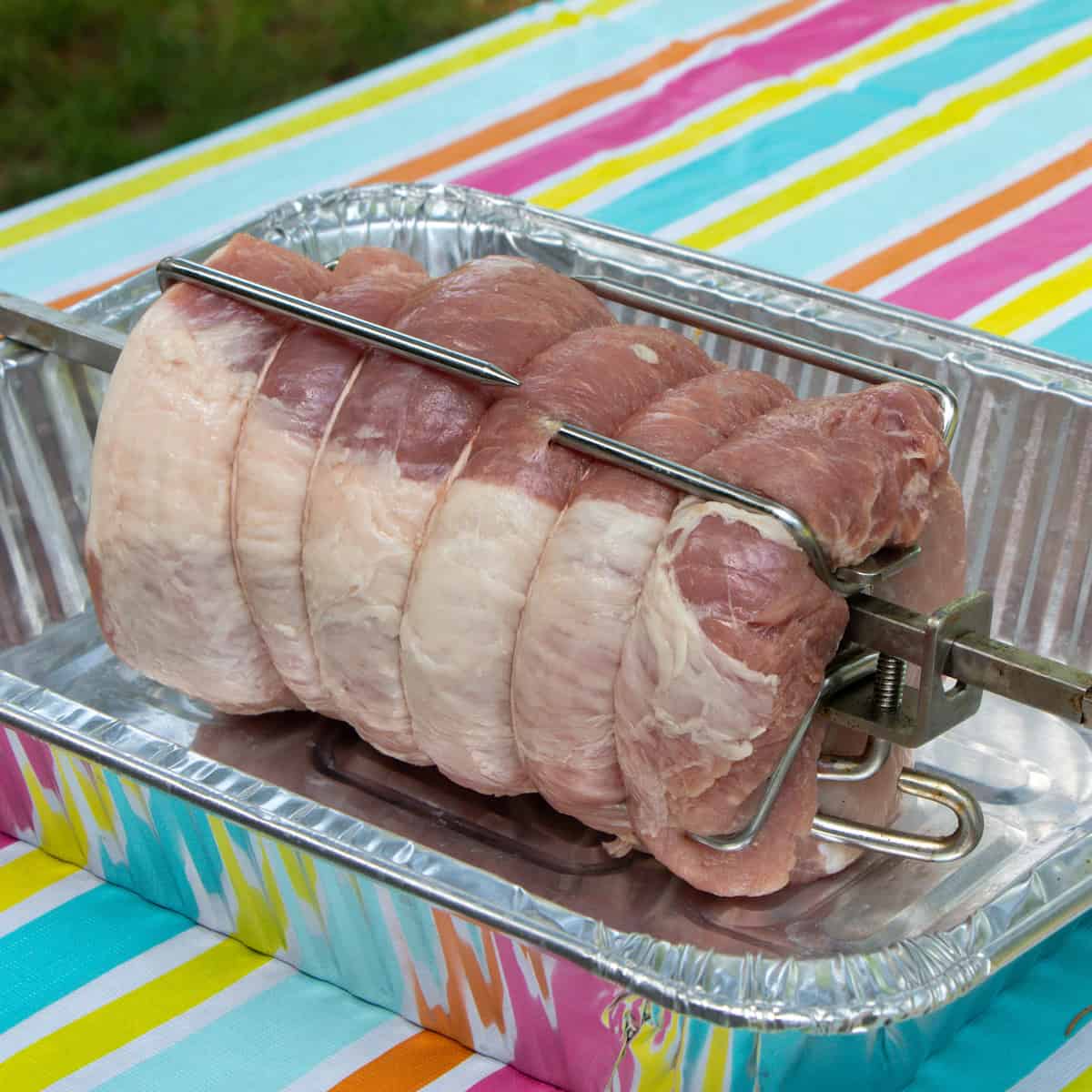 Pork loin roast on a spit.