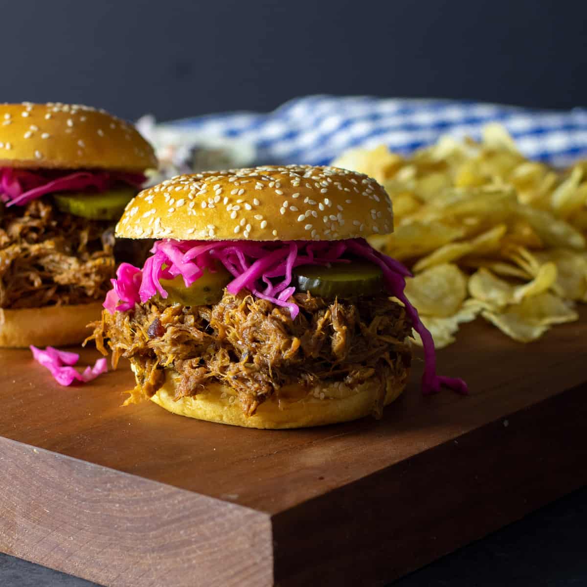 A close up picture of a pulled pork sandwich.