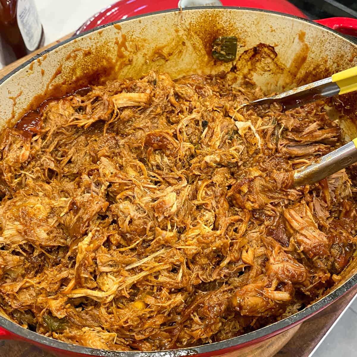 Shredded pork meat with BBQ sauce.