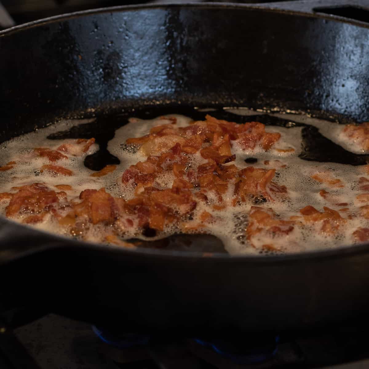Bacon frying in a pan.