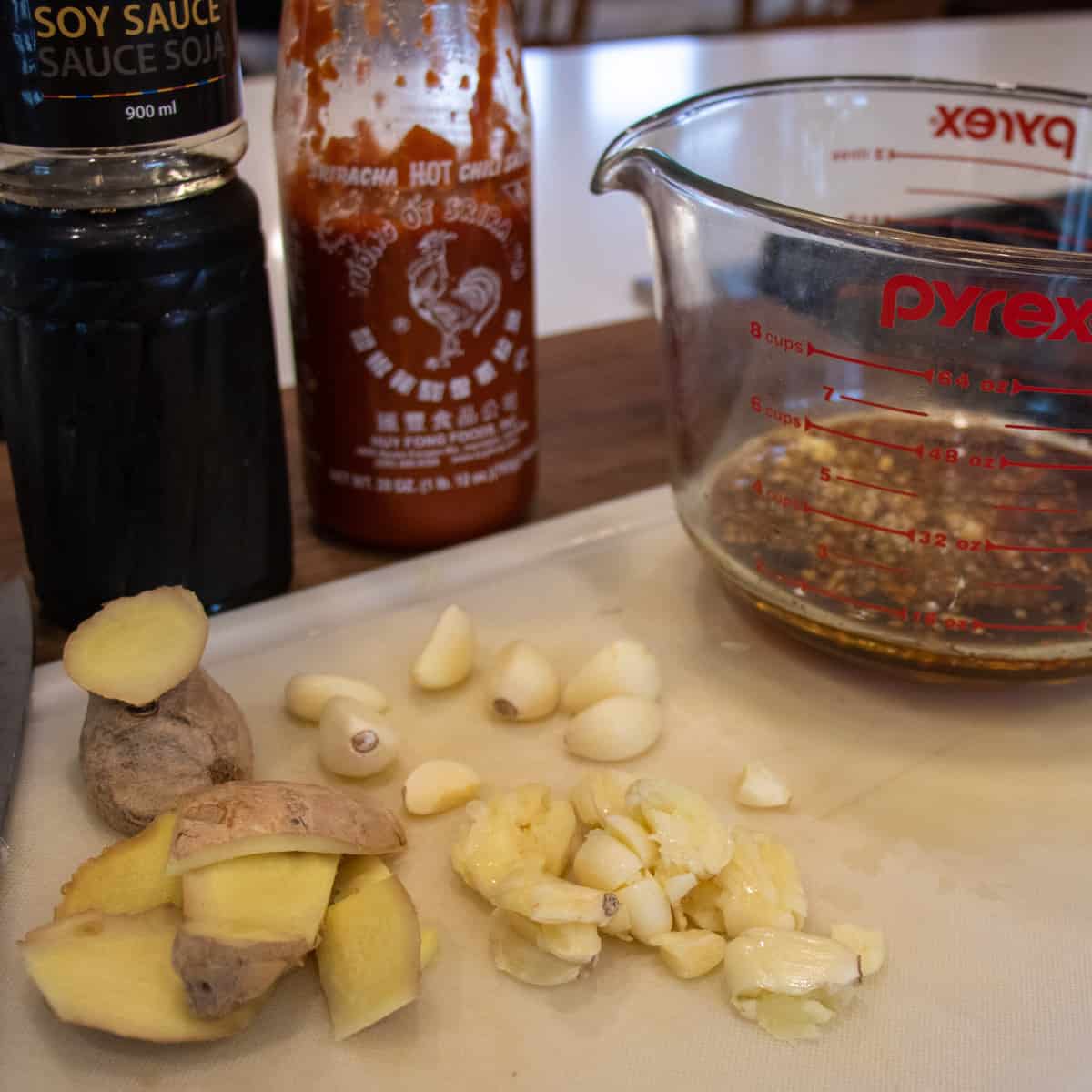 Fresh ginger and garlic on a cutting board