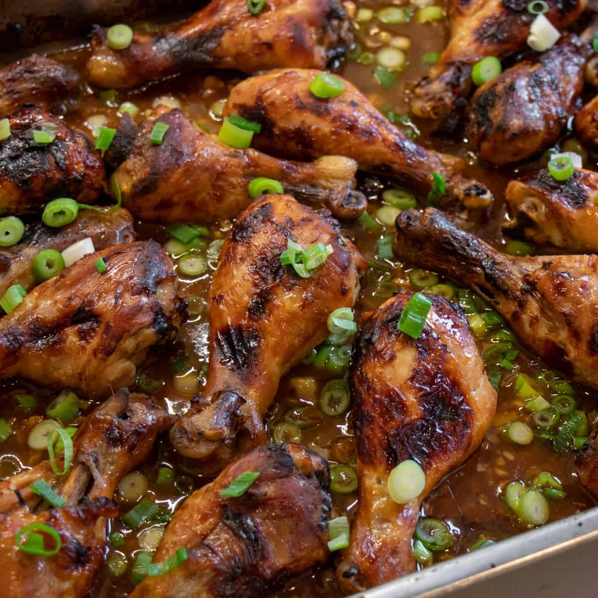 Baked chicken drumsticks in a baking pan