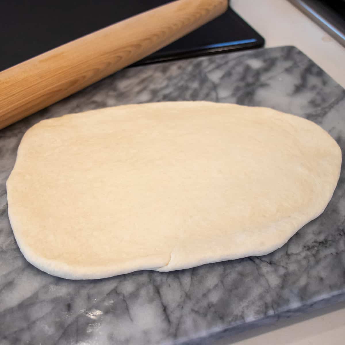 Dough rolled out flat with a rolling pin.