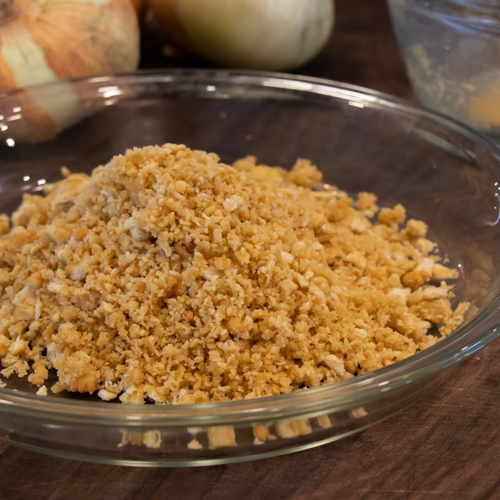 Cracker crumbs dumped into a pie pan.