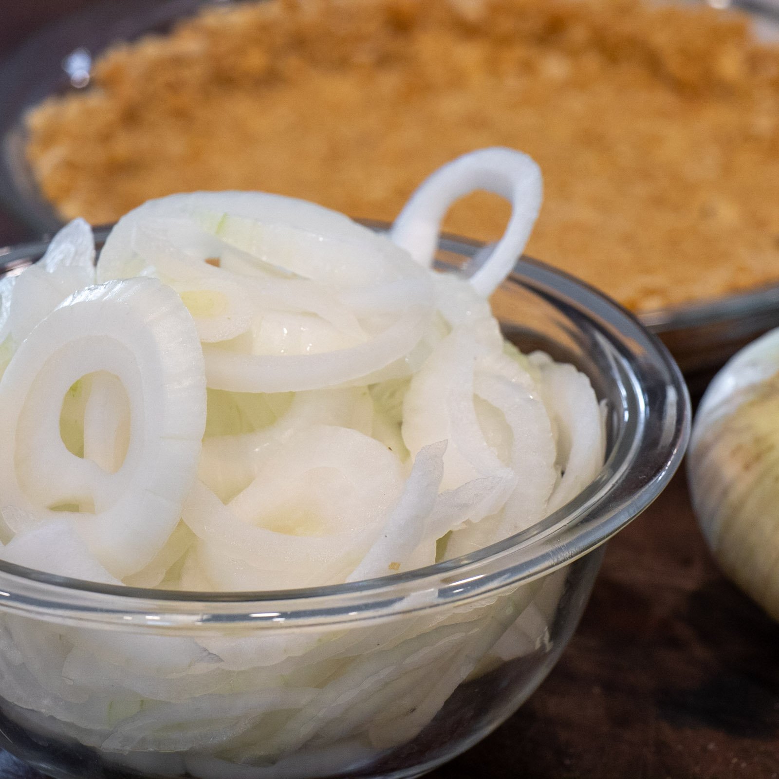 A bowl full of sliced onions.