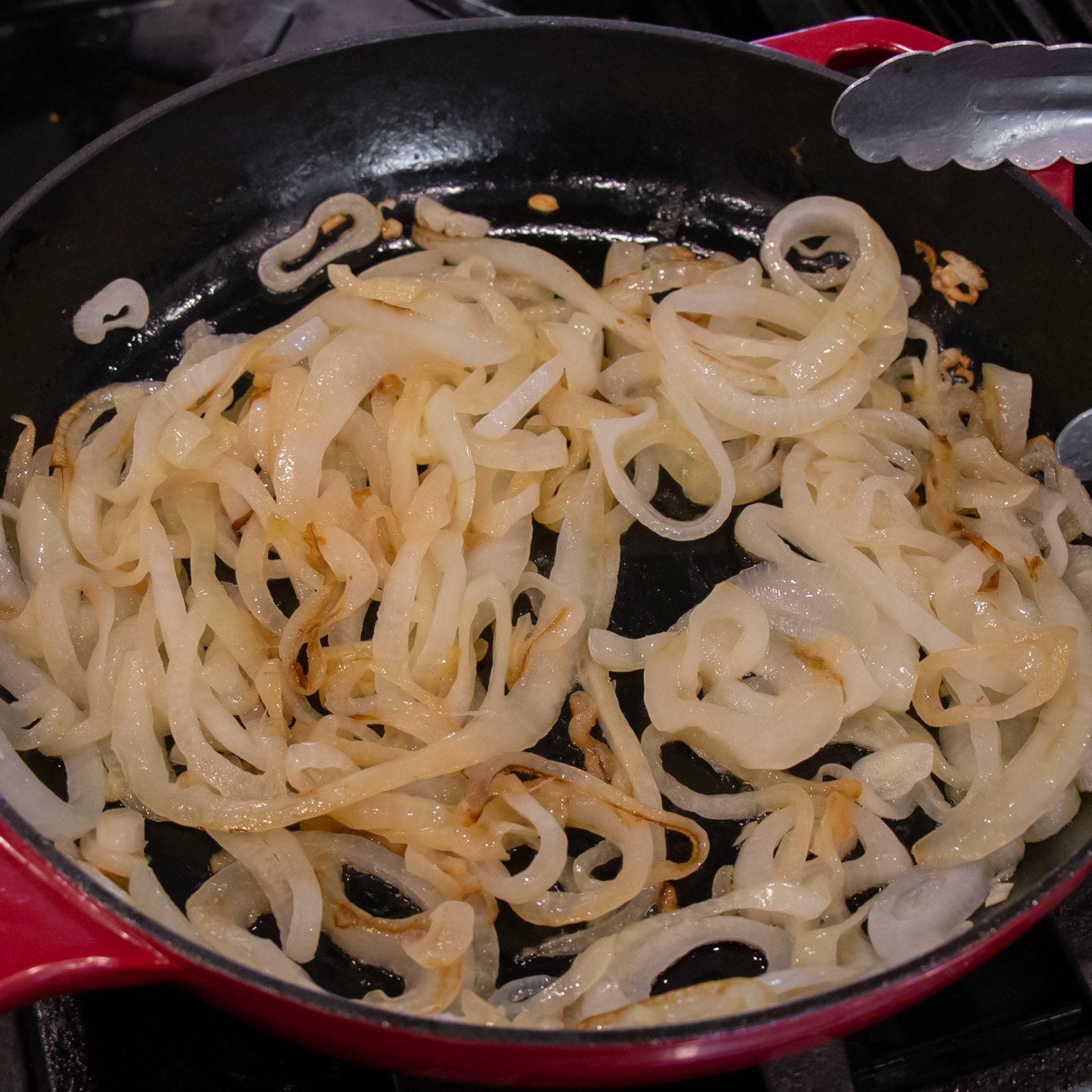 Caramelized onions in a frying pan.