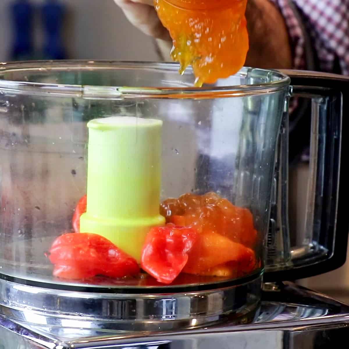 Cored habanero peppers and apricot jam in a food processor.