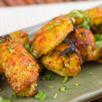 A plate of baked chicken wings.