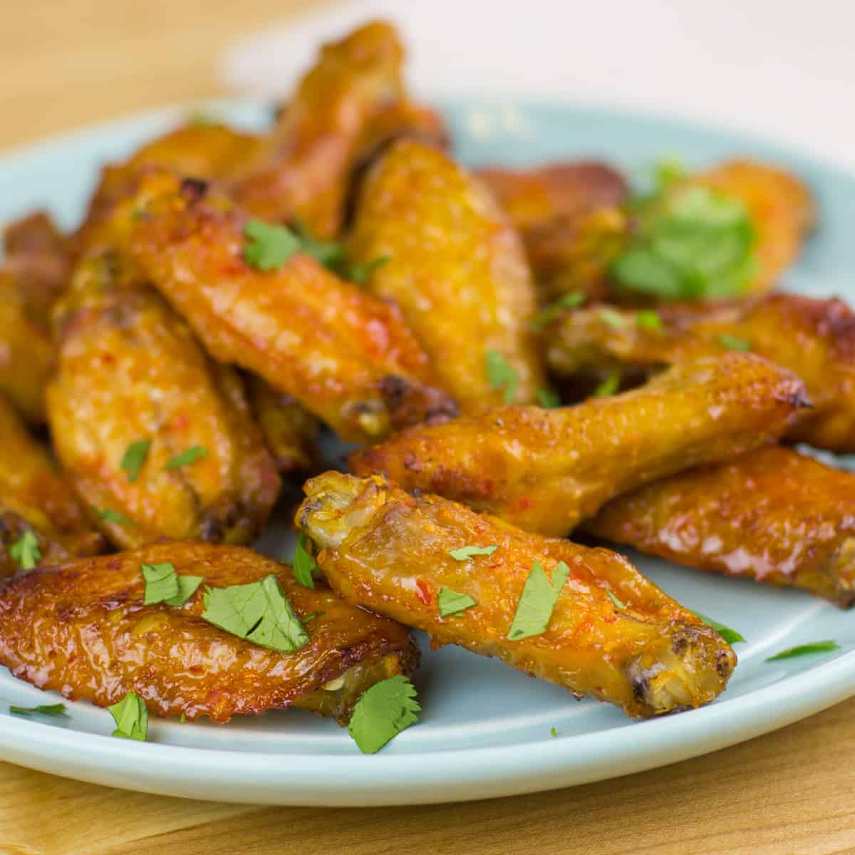 A plate of baked chicken wings.