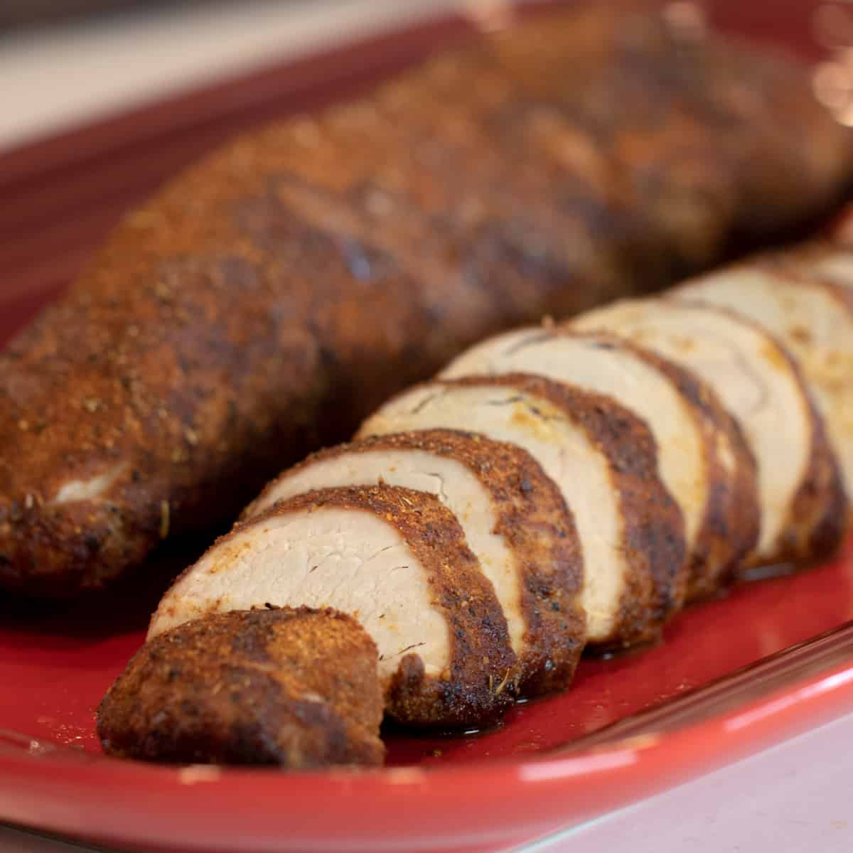 Sliced pork on a serving platter.