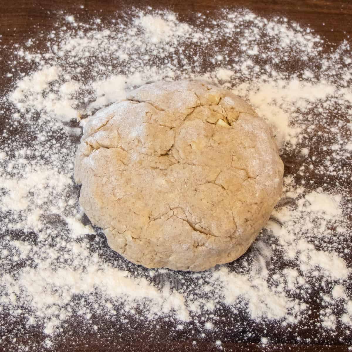 Scone dough on a lightly floured work surface.