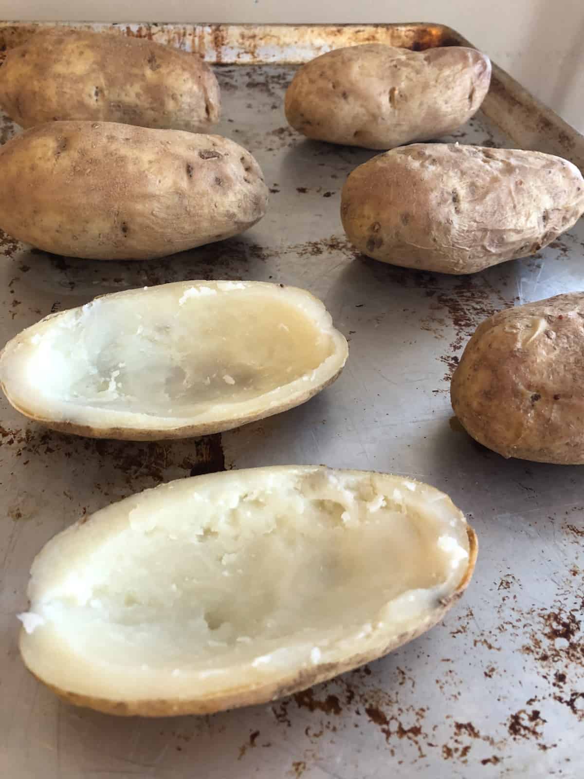 Baked potatoes halved and hollowed out.