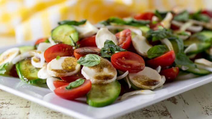 Caprese salad served on a large platter.