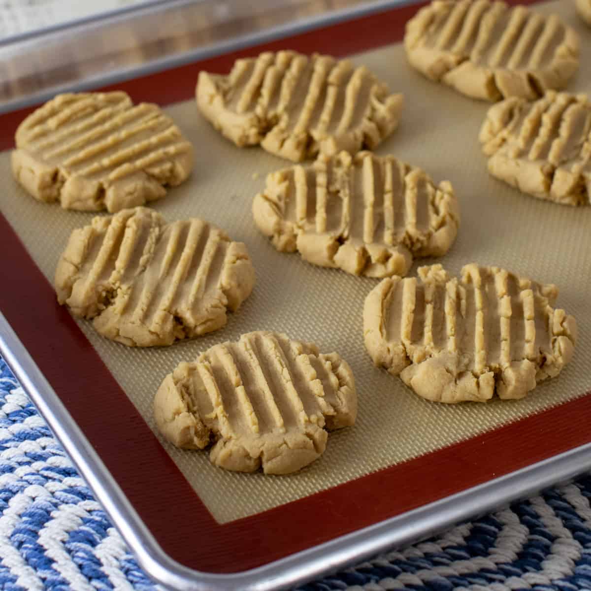 Fresh baked cookies on a baking sheet.