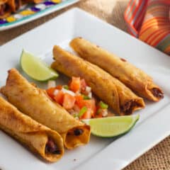 A plate of flautas ready to serve.
