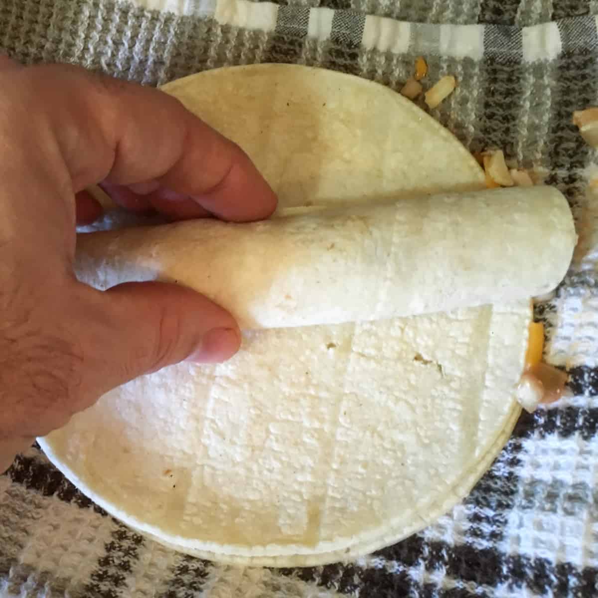 A rolled up flat ready to go in the hot oil.