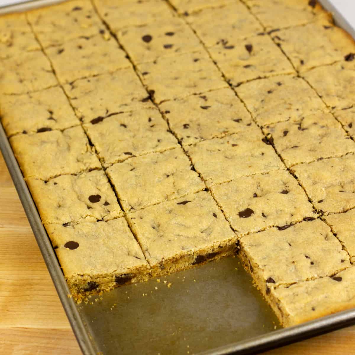 Baked cookie bars cut and divided.