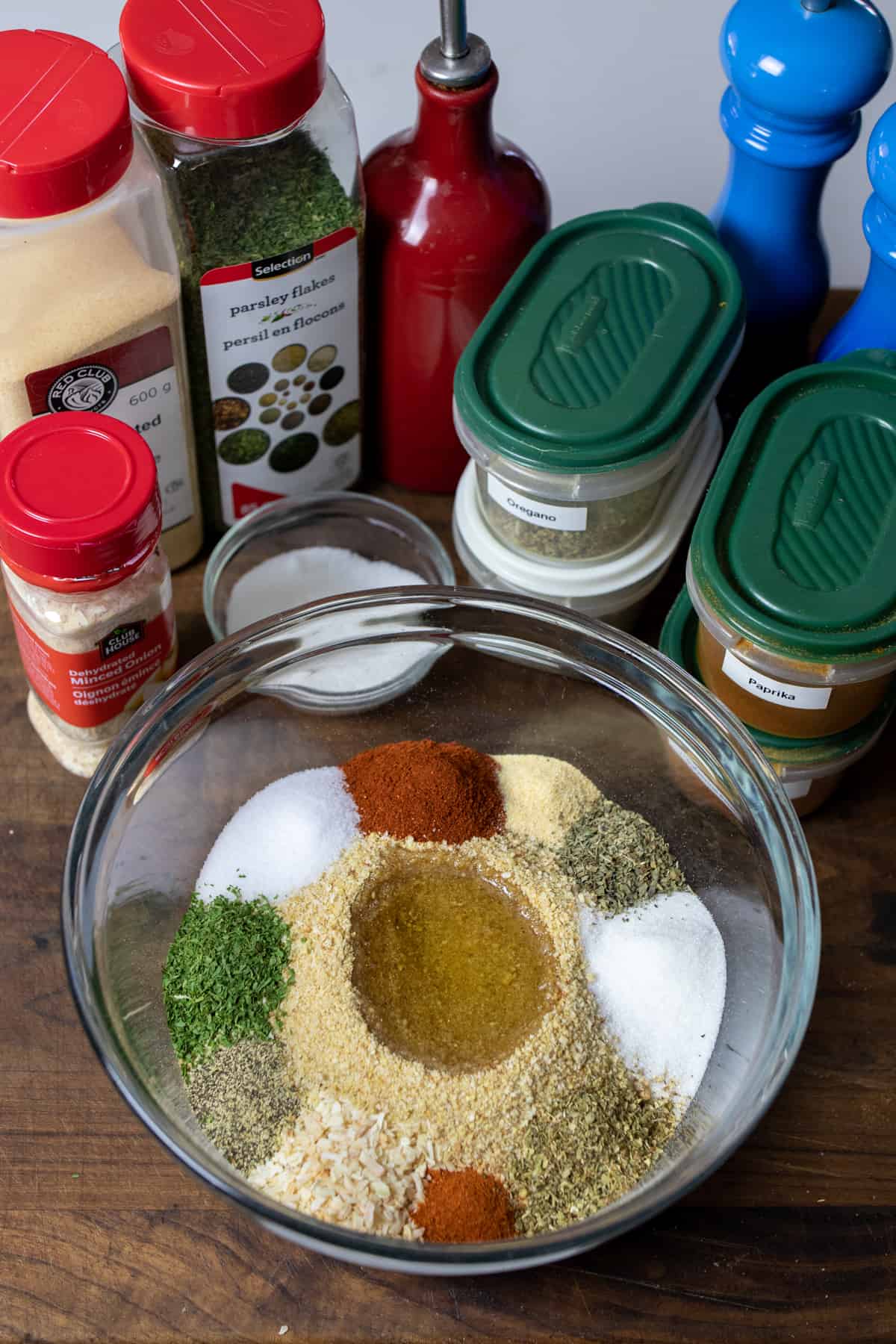 All of the ingredients added to a glass bowl so that each ingredient is separate from each other.