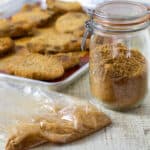 Homemade Shake and Bake pork chops and extra breading mixture in a jar.