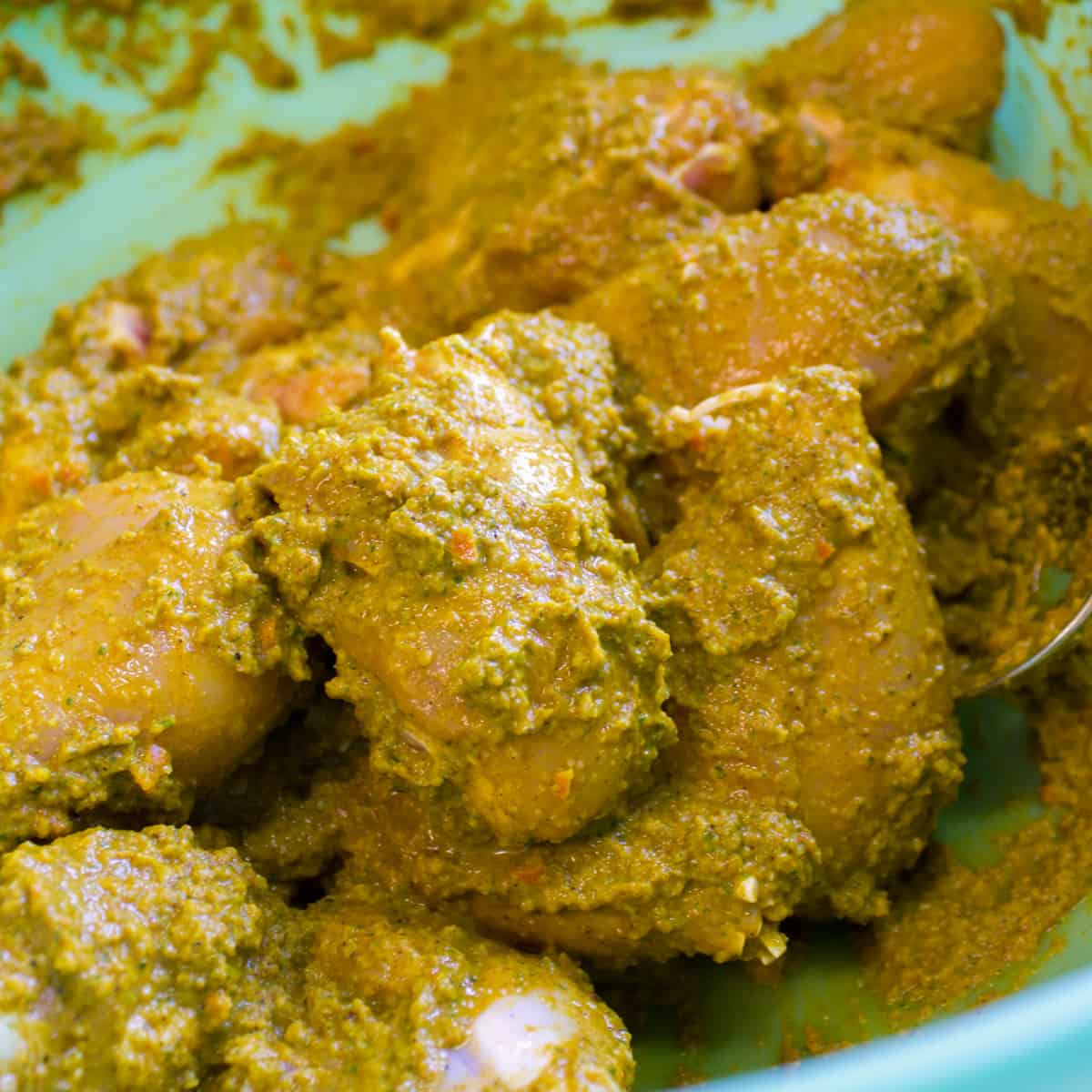 Chicken drumsticks tossed in the curry paste.
