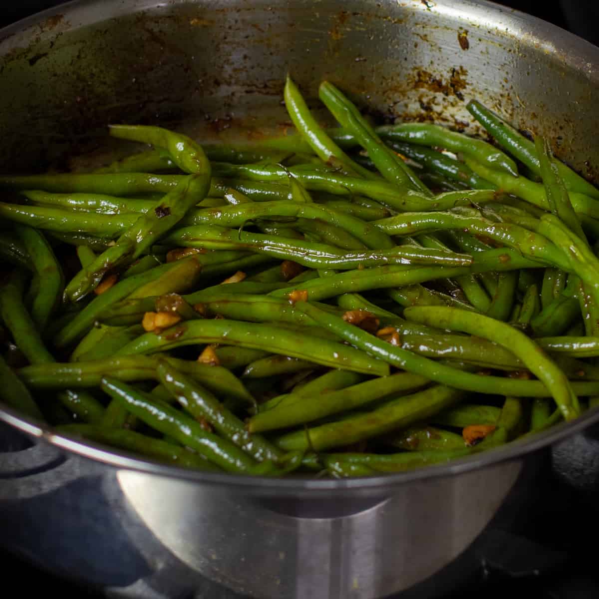 Cooked beans in a frying pan.