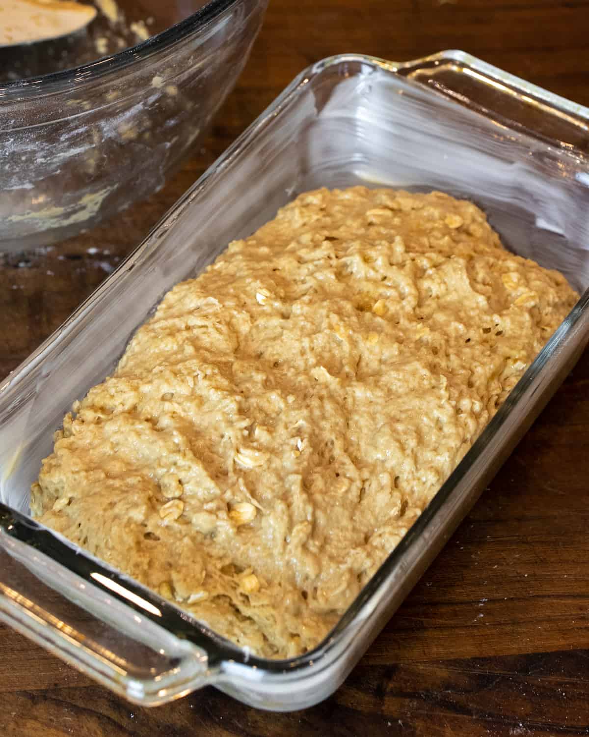 Loaf batter spread into a greased glass dish.