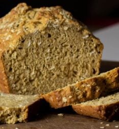 A loaf of beer bread with a couple slices.