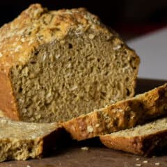 A loaf of beer bread with a couple slices.