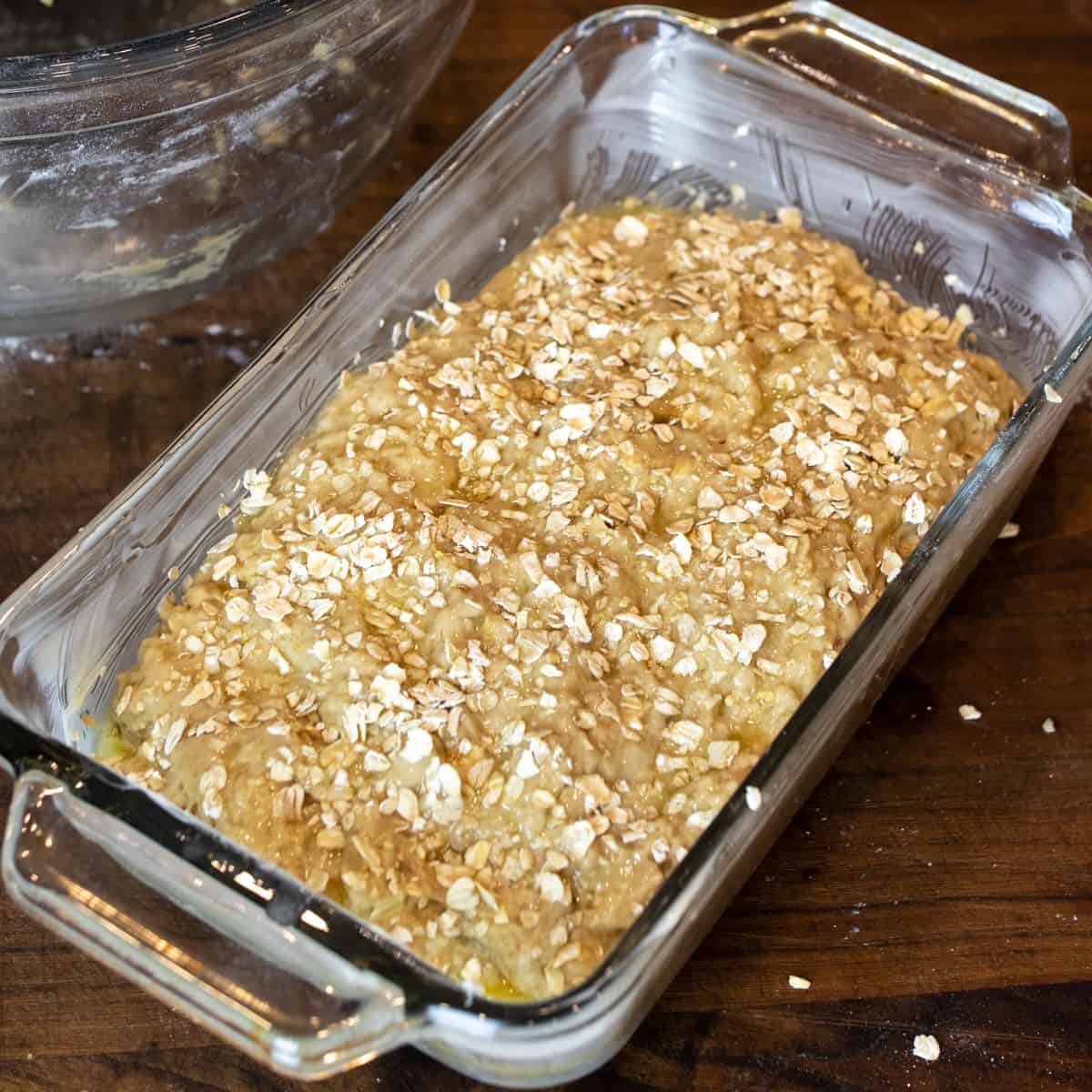 Bread batter in a loaf pan ready to go into the oven.