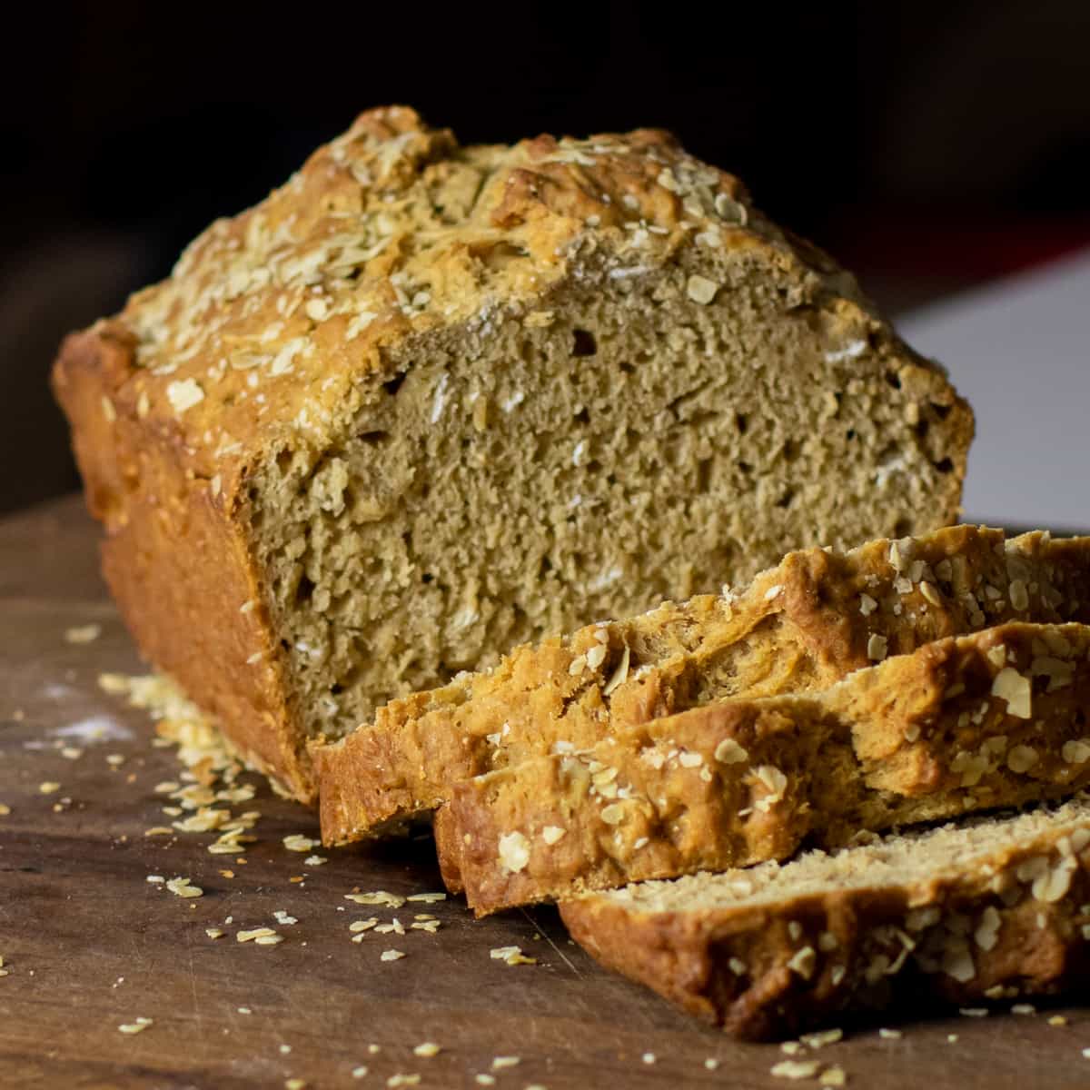 Loaf of bread with a few slices cut.