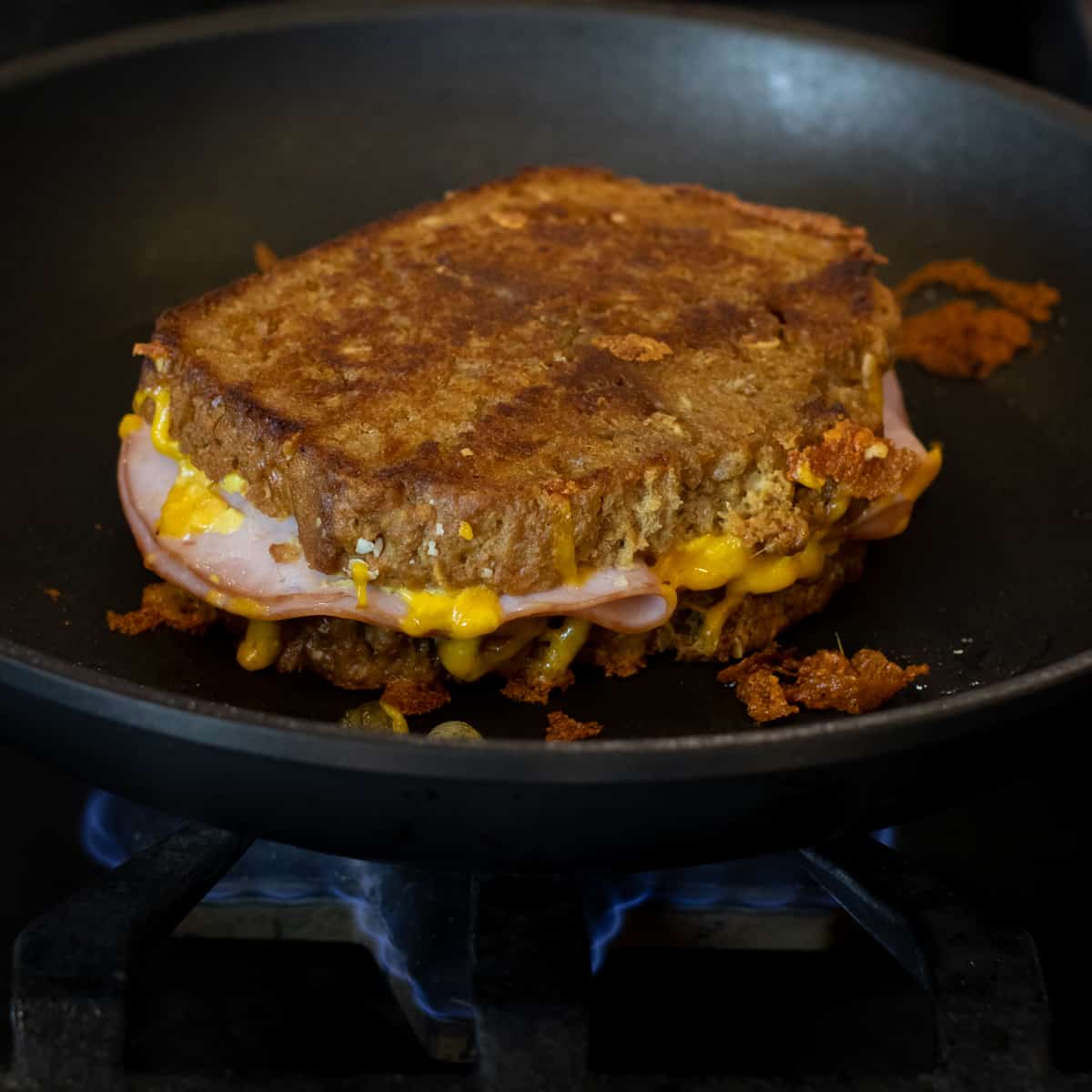 Grilled cheese finished cooking and ready to come out of the pan.