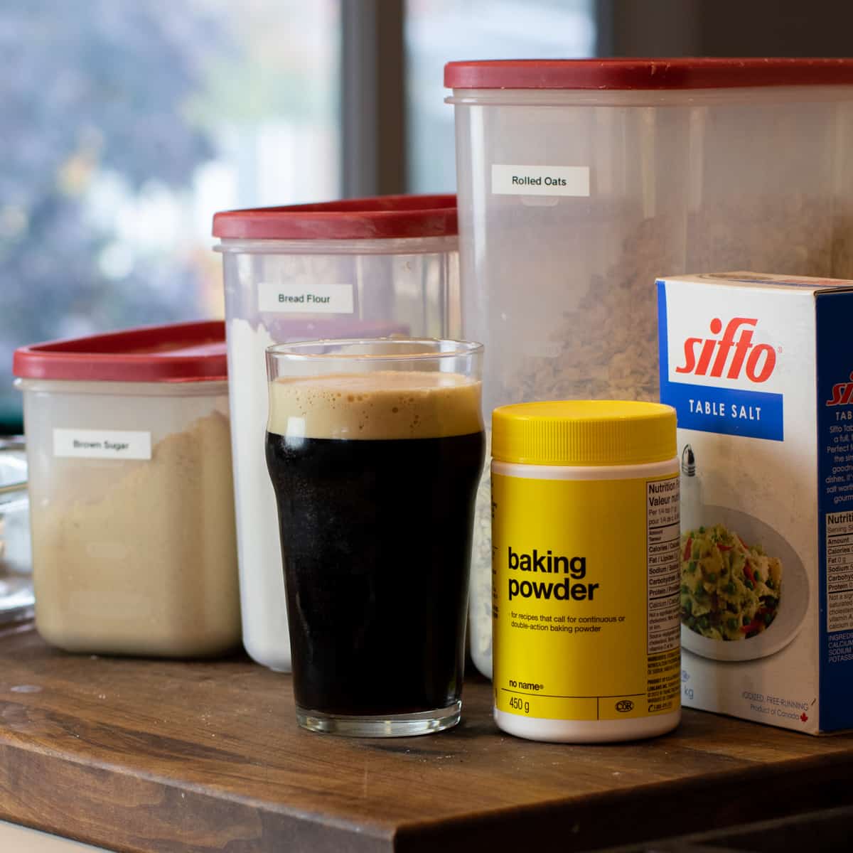 Ingredients for bread collected on a cutting board.