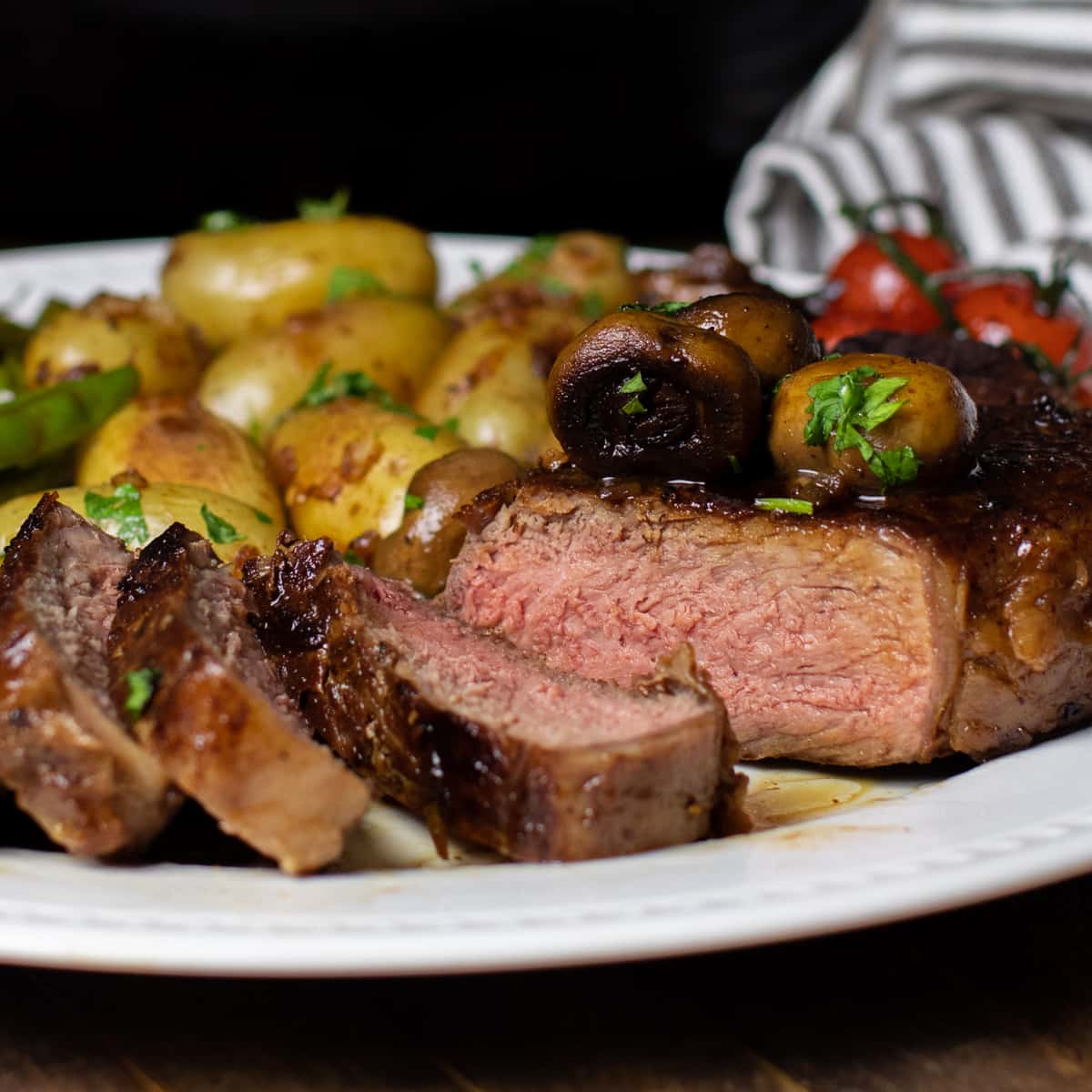 A close up of a sliced medium rare steak.