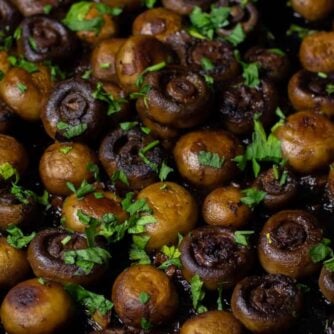 Cooked mushrooms in a frying pan.