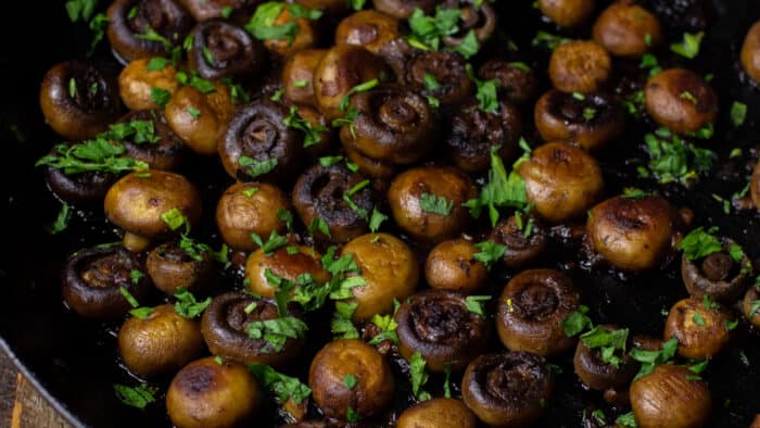 Cooked mushrooms in a frying pan.