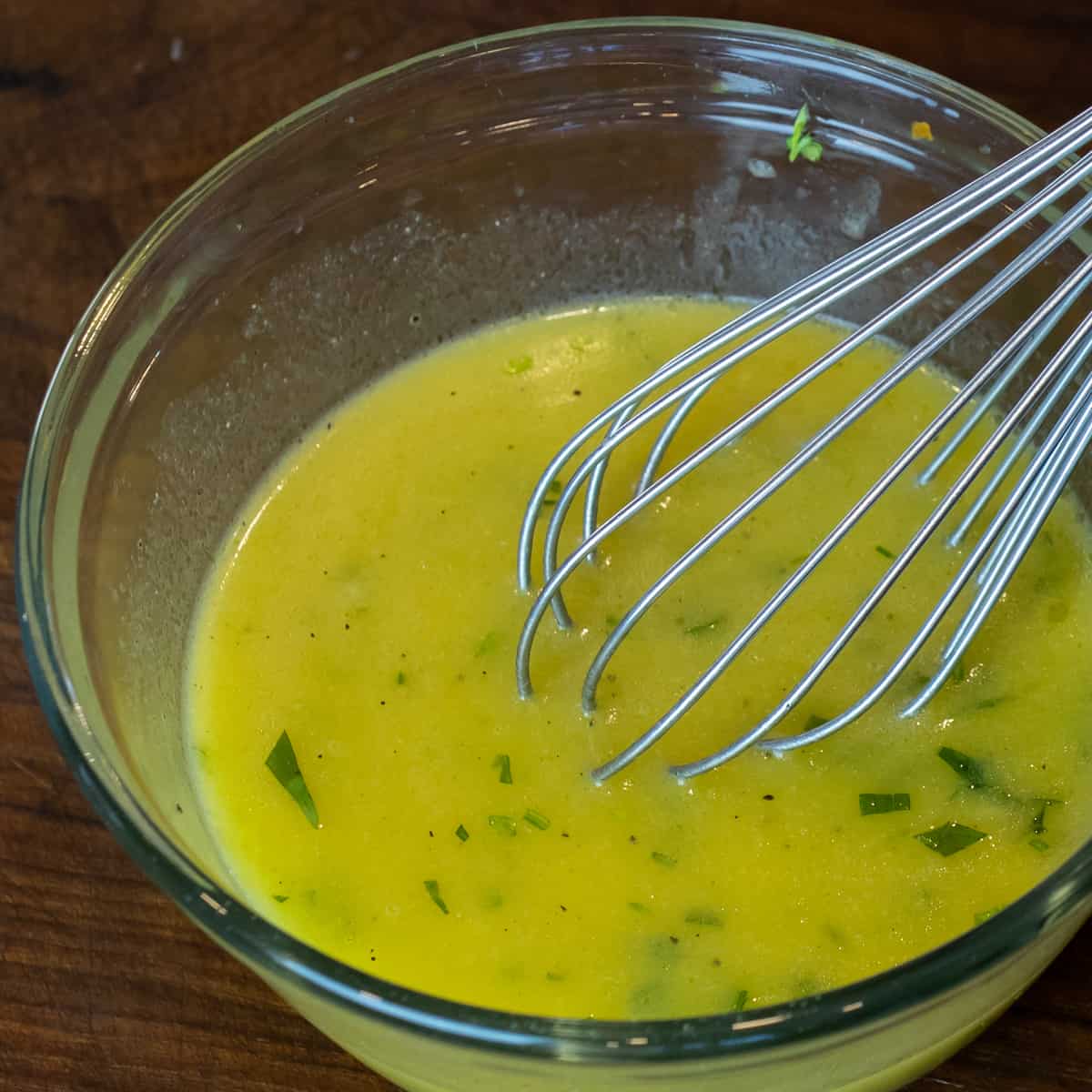 Salad dressing emulsified together with a metal whisk.