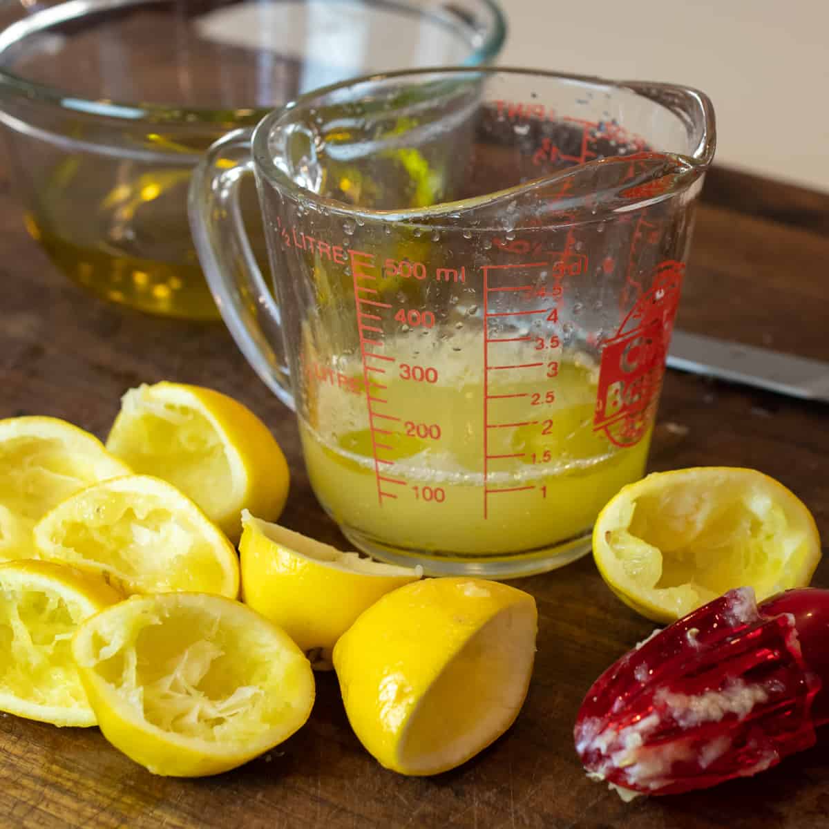 Freshly squeezed lemon juice in a measuring cup.