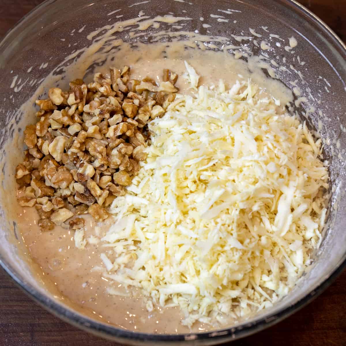 Grated parsnips and chopped walnuts on the mixed batter.