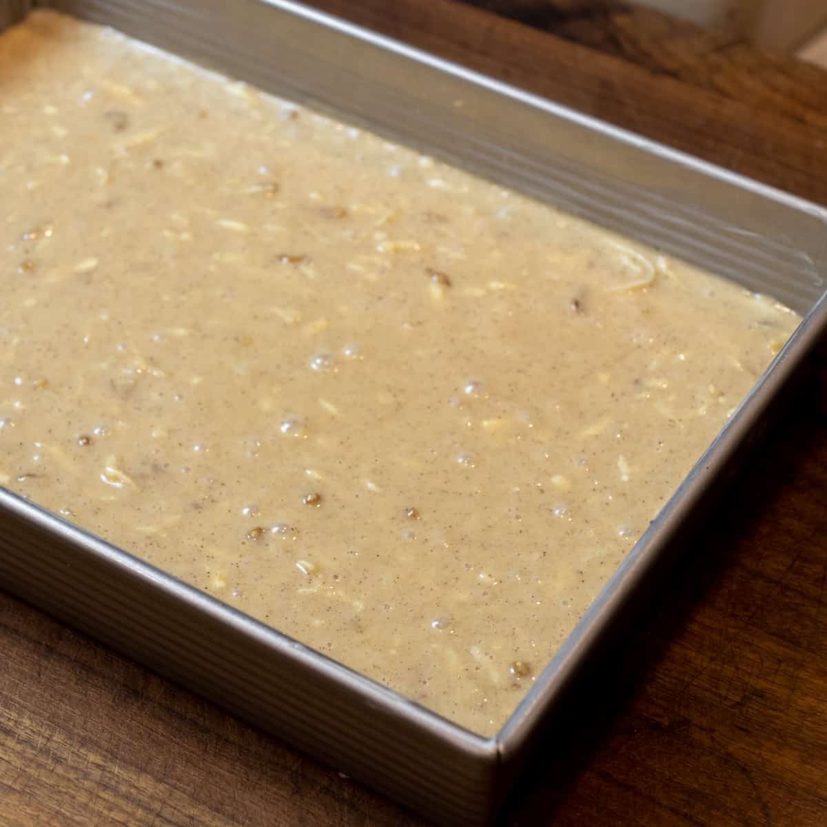 Cake batter in a rectangular baking dish.