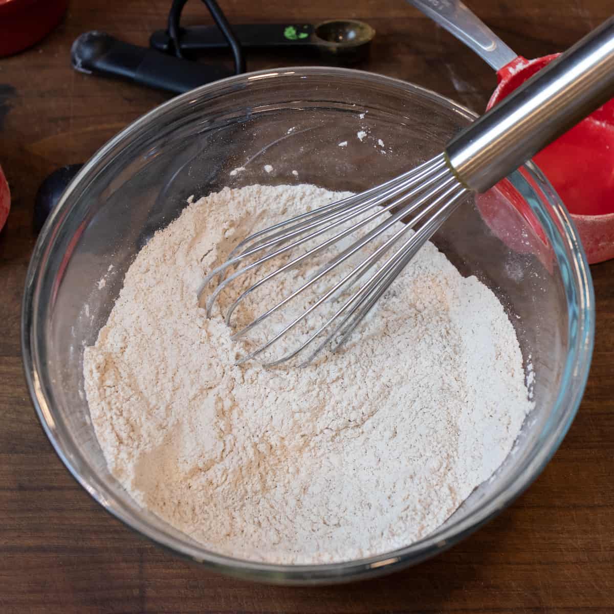 Sifted dry ingredients in a glass bowl
