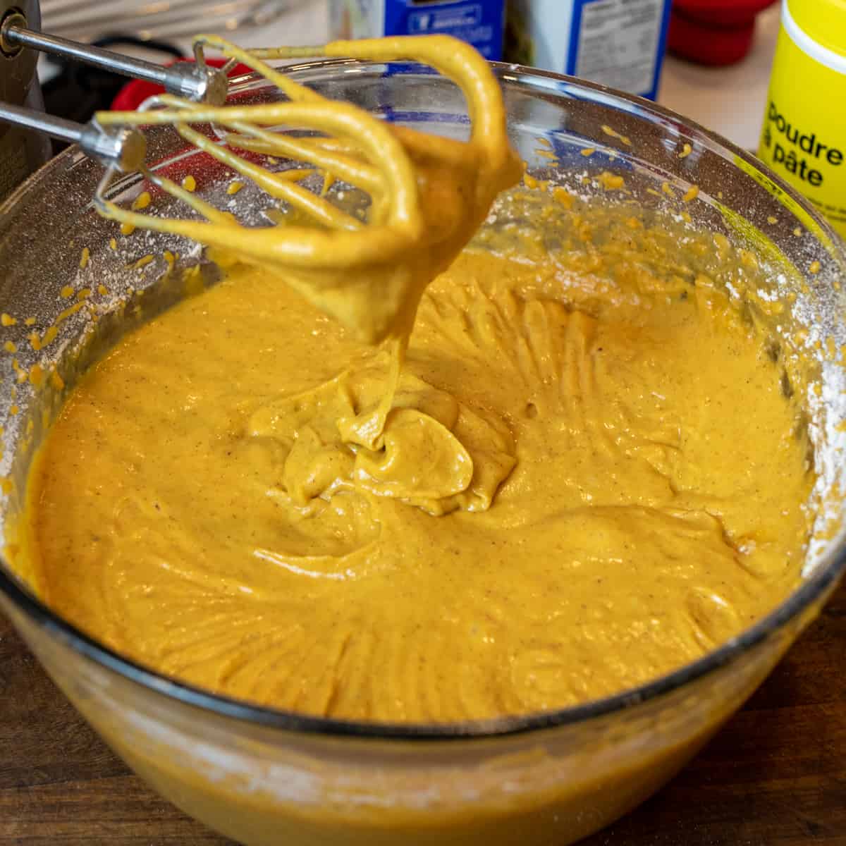 Pumpkin loaf batter mixed and ready to pour into loaf pans.