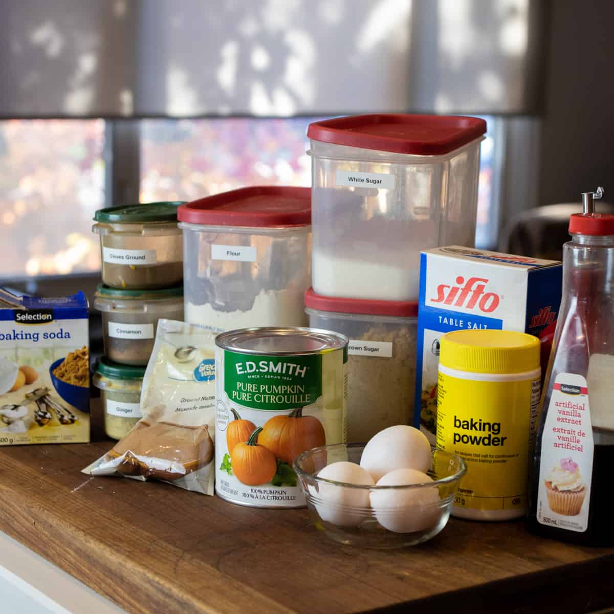 Ingredients needed for the recipe gathered together on a wooden cutting board.