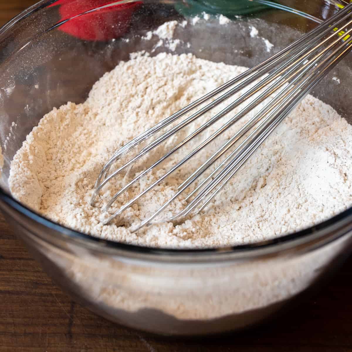 Dry ingredients sifted together in a glass bowl.