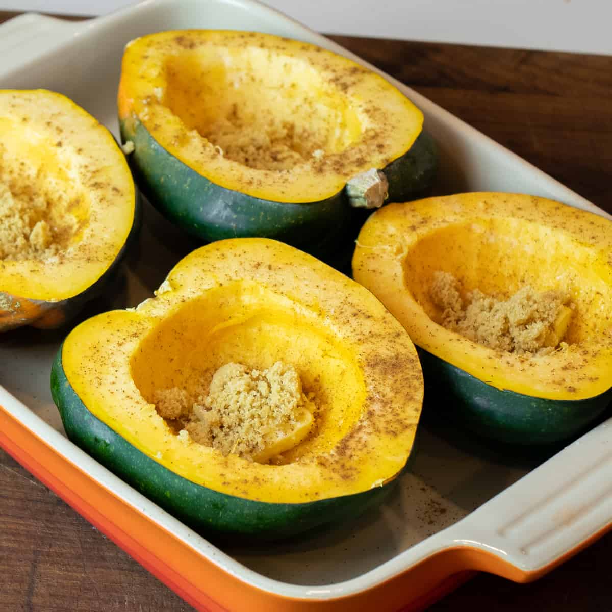 Butter, brown sugar and cinnamon in the hollowed out portion of an acorn squash.